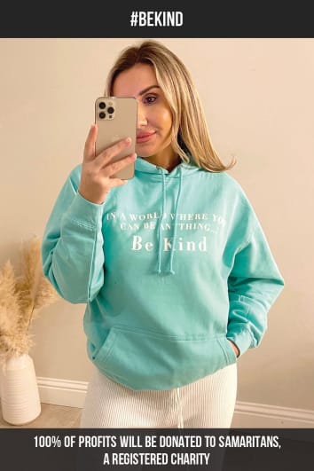 TURQUOISE IN A WORLD WHERE YOU CAN BE ANYTHING BE KIND HOODIE
