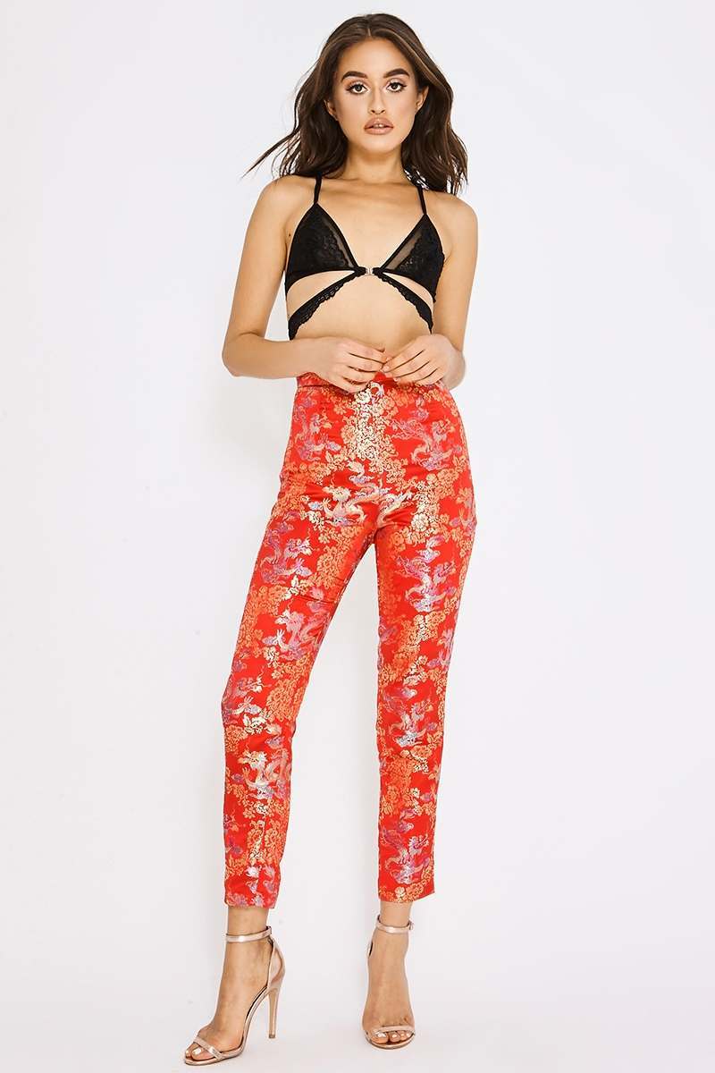 red tapered oriental jacquard trousers