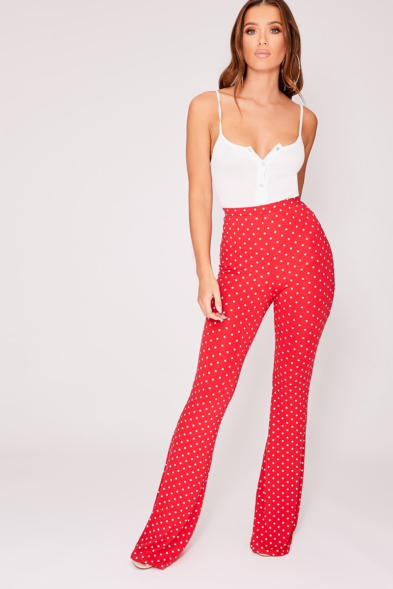 red polka dot jersey flare leg trousers